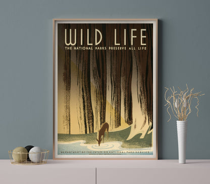A framed vintage travel poster featuring a forest and a wild animal, with the text 'Wild Life - The National Parks Preserve All Life'.